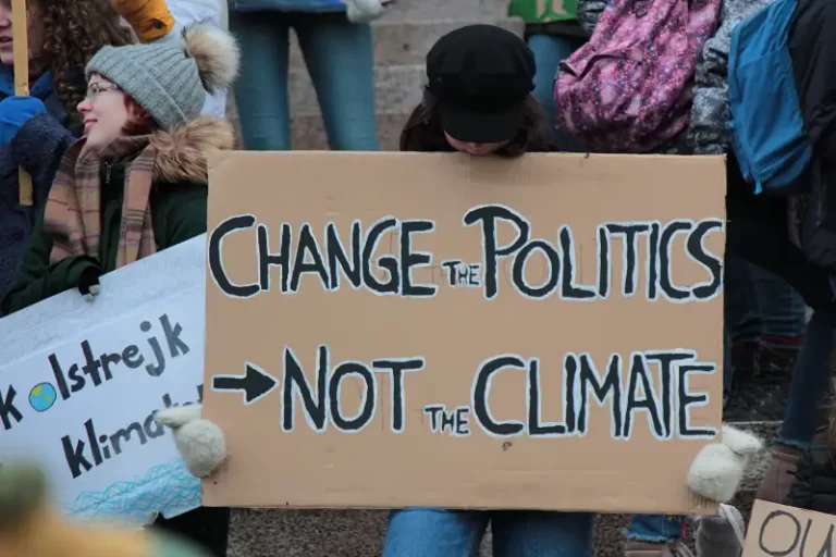Protest placard reading 'change politics not the climate'