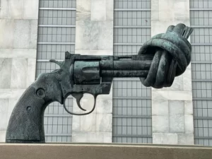 A statue of a revolver with the barrel twisted into a knot. Symbolic violence.