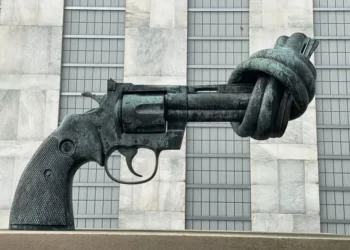 A statue of a revolver with the barrel twisted into a knot. Symbolic violence.