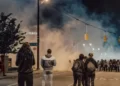 a violent street protest with smoke