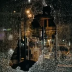 a view through a smashed window - violence