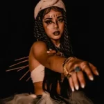 a model posing as a mambo voodoo priestess