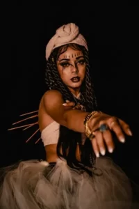 a model posing as a mambo voodoo priestess