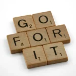 Scrabble tiles readin 'go for it' - action