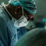 A black surgeon side view