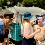 football hooligans having beer in the sun