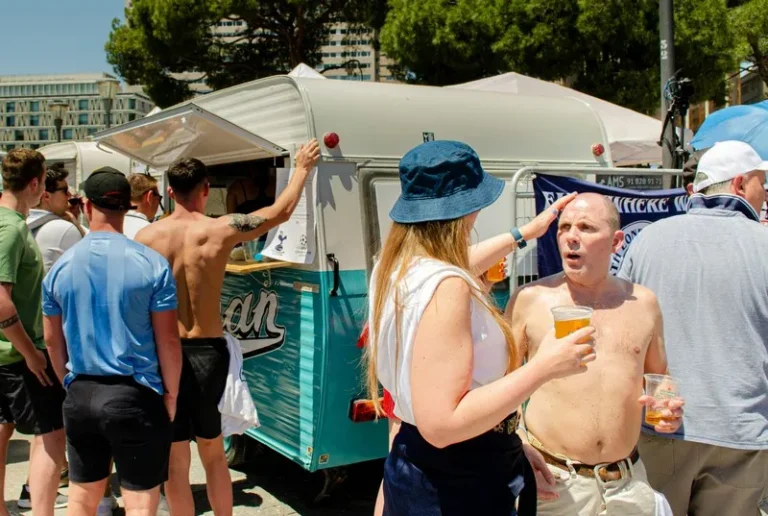 football hooligans having beer in the sun