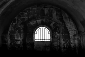 An old jail cell in black and white