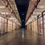 A line of prison cells representing collective punishment