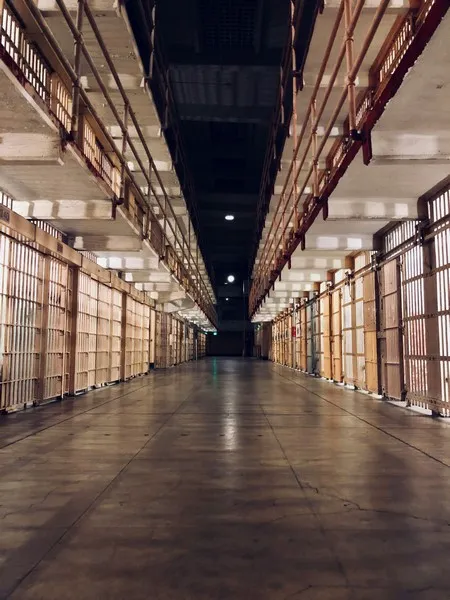 A line of prison cells representing collective punishment