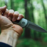 A hand holding a knife