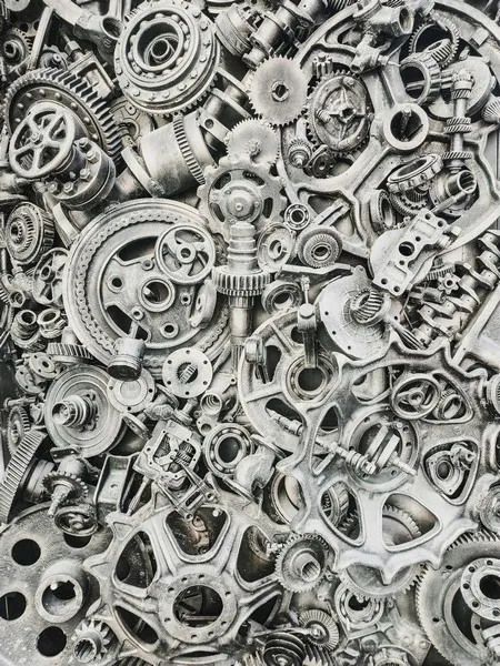 a large collection of mechanical parts in grey