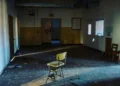 A lonely chair in an abandones school