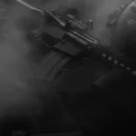 A fully automatic assault rifle in black and white with smoke