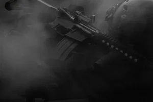 A fully automatic assault rifle in black and white with smoke
