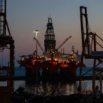 Oil rigs at sunset