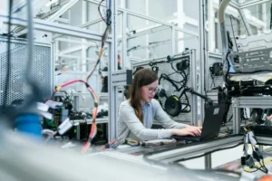 A woman in technology working at a bench
