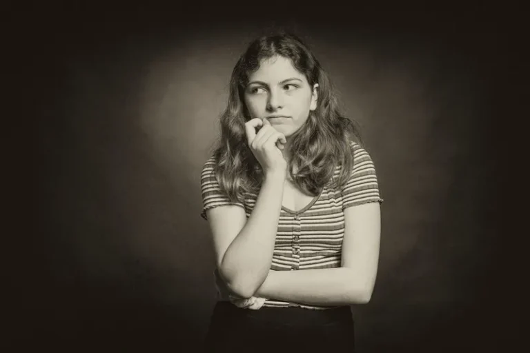 A sepia image of a woman thinking cognitively