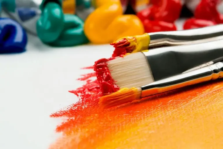 A paint brush with orange paint