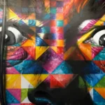 A mosaic style artwork of a face looking horrified