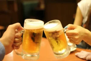 Two beer glassing clinking.
