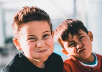 Two boys pulling ridiculous faces