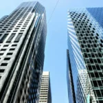 Some tall corporate buildings on a sunny day