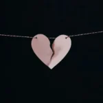 A pink paper broken heart for divorce