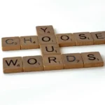 A scrabble crossword with forms the words 'choose your words'