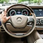 A mercedes steering wheel demonstrating conspicuous consumption