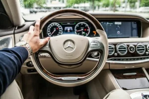 A mercedes steering wheel demonstrating conspicuous consumption