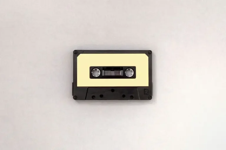 A cassette tape with a yellow label
