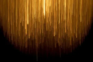 gold light droppings on a black background