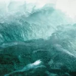 A sea blue abstract art piece resembling waves crashing