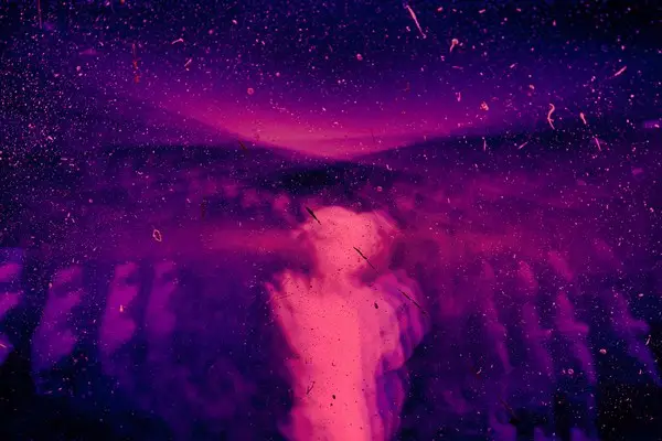An abstract ghostly figure in various shades of purple