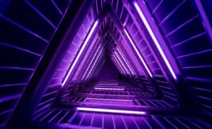 purple flourescent lights arranged in the shape of a triangular tunnel