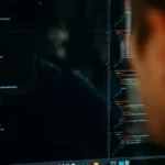 A man looking at sampling code