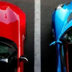 Two convertable cars lined up next to each other