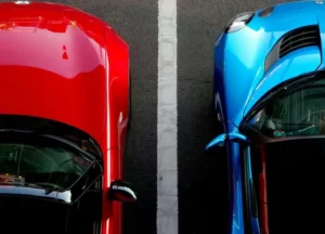 Two convertable cars lined up next to each other