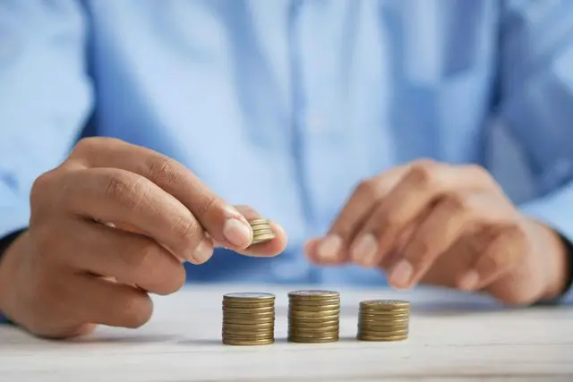 A man counting his coin