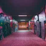 An underpass covered in urban graffitti
