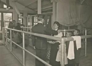 A historical photo showing people in an immigration queue