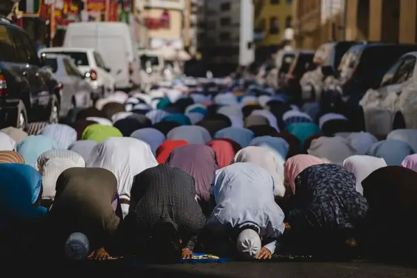 A large group of muslims praying