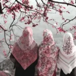 three muslim women viewed from behind