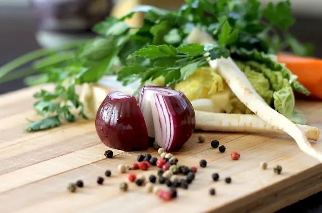 A raw onion on a chopping board