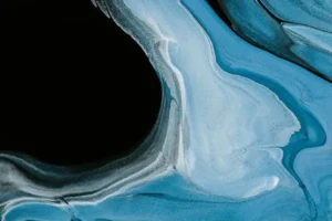 An abstract piece resembling a sink hole surround by blue ice
