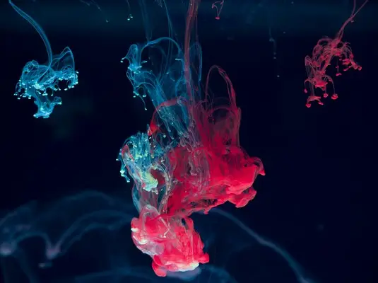 An abstract liquid form of blues and reds