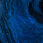 An abstract blue image resembling the microscopic view of a human hair