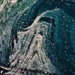 An abstract space-like image with waves of white paint