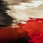 Abstract black, red, and white paints.